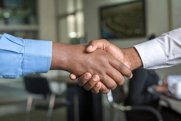Two hands shaking each other presumably after a job interview offer accepted.